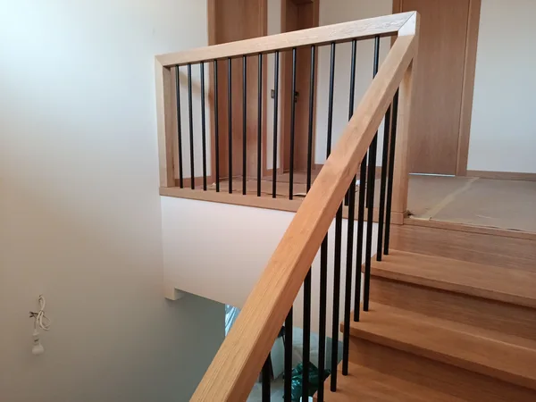 STAIRS WITH BLACK METAL RAILINGS